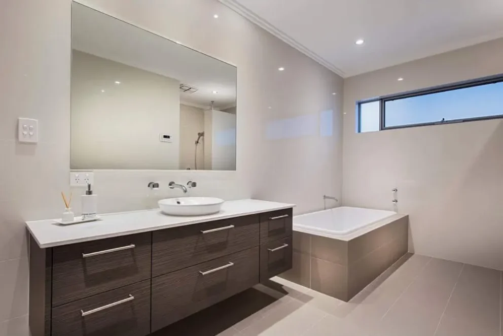 Bathroom with cabinets and bath